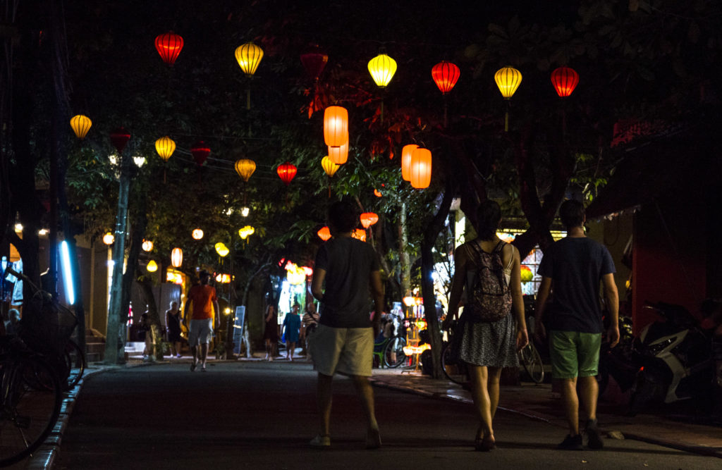 friends walking at Hoi An at night
