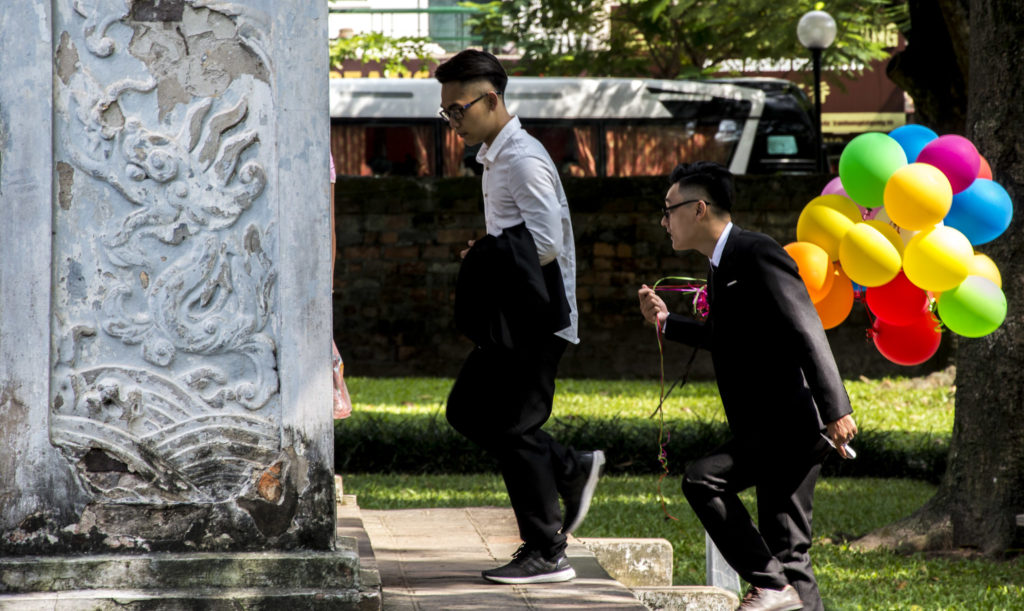 Temple of Literature men with balloons