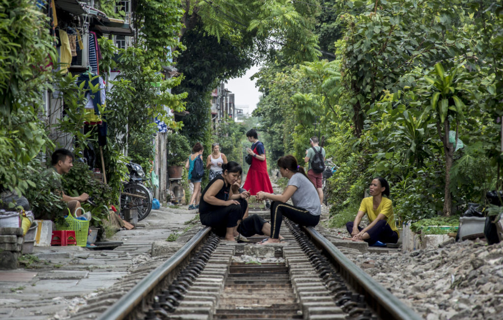 Vietnamese people on the railway lines